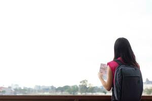 Back scene of woman alone with feeling lonely and depressed on blurred background of beautiful nature scenery . concept of woman who had to be alone in past was depressed when she encountered problems photo