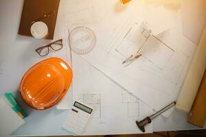 Equipment and drawings lying on desks inside the offices of architects and engineers. background of an architect's workbench getting ready for work to achieve the desired outcome of the client. photo