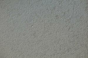 background old concrete wall that shows signs of cracking and deterioration from weather and age. Concrete backgrounds with natural textures are great for designs and include Copy Space backgrounds photo