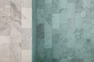 Marble tile backgrounds with beautiful natural patterns are used for flooring and interior swimming pools because they are easy to clean. Marble tile background  and Copy Space for inserting text. photo