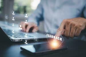 Feedback on Information Technology Concepts, Business people using laptops with Consulting Presents global internet connection technology business, digital marketing, financial communications photo