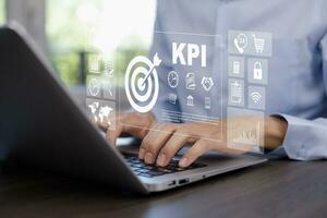 Key Performance Indicator Planning KPI, Company Management Business Internet Technology Concept, Businessman using a laptop with document management, enterprise resource management software system photo