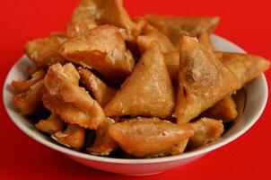 Close-up photography of delicious and sweet plate full of fresh traditional luxurious Moroccan handmade Brewat sweets. Arabic traditional oriental sweets on the festive table photo