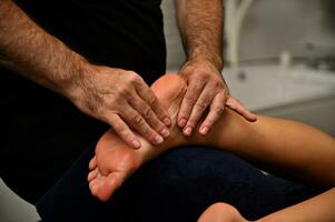 Reflexology foot massage. Foot treatment in the Ayurvedic wellness spa resort photo