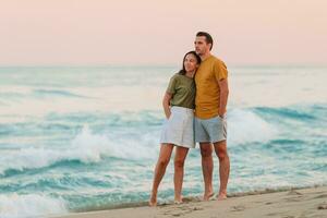 Young couple on the beach vacation on tropical island photo