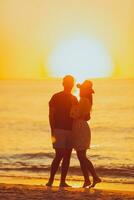 Young couple on white beach during summer vacation. photo