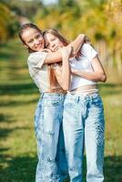 Beautiful teen girls having fun together on summer tropical vacation photo