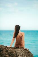 Young happy woman on the beach enjoy her summer vacation photo