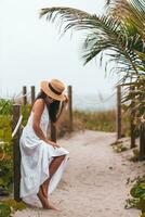 Happy woman on the beach vacation photo