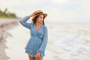 Happy girl enjoy summer vacation on the beach photo