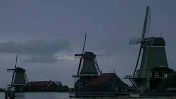 View of windmills and houses in the Zaanse Schans museum, Netherlands video