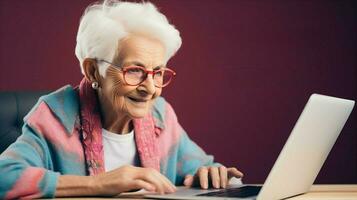 An elderly woman learning to code on a laptop, challenging age - related stereotypes. Generative AI photo