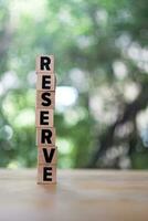 Word RESERVE made with wood building blocks photo