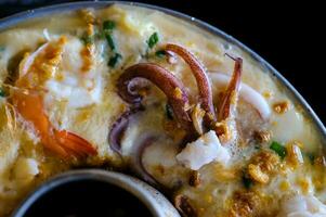 Hot pot steamed egg with shrimp and squid photo