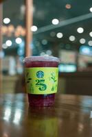 Bangkok, Thailand - August 22, 2023 Green paper cup sleeve of  Starbucks Thailand celebrates 25 years photo