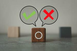 A choice between two way with tick mark and cross mark x on in speech bubble. photo