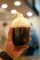 Delicious cool soft drink topping with soft serve photo