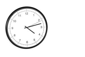 Part of analogue plain wall clock on white wall background. Four o'clock twelve minutes. Close up with copy space, timing, time management, opening hours time, school concept and lunch time. photo