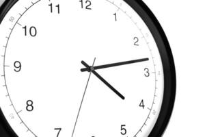 Part of analogue plain wall clock on white wall background. Four o'clock twelve minutes. Close up with copy space, timing, time management, opening hours time, school concept and lunch time. photo