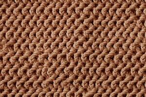 Background with knitted pattern. Texture of wool fabric photo