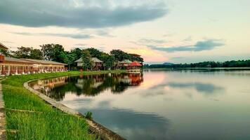 Sunset in Bueng Chawak lake in Suphaburi province, Thailand, where is a big national park, zoo, sharks etc. photo