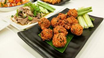 Thai traditional food and E-san foods with spicy pork balls photo