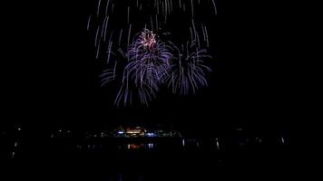 fireworks over the temple in the dark sky photo