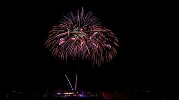 fireworks over the temple in the dark sky photo