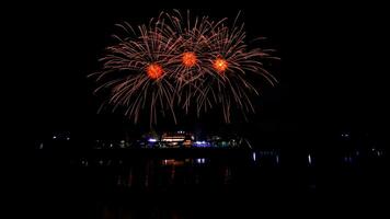 fireworks over the temple in the dark sky photo