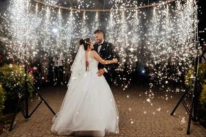 First wedding dance of newlywed. Happy bride and groom their first dance. brides wedding party in the elegant restaurant with a wonderful light and atmosphere photo