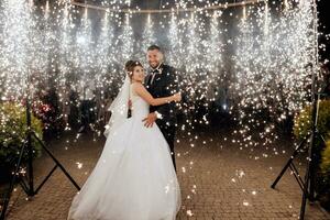 First wedding dance of newlywed. Happy bride and groom their first dance. brides wedding party in the elegant restaurant with a wonderful light and atmosphere photo