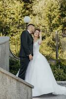 Happy bride and groom after wedding ceremony. Stylish groom. Adult groom. look at each other. Amazing wedding couple photo