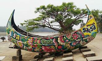 A beautiful sampan kept standing in sea beach, popular sampan boat. photo