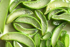 Fresh aloe vera slice top view background,  Natural organic aloe vera slice photo