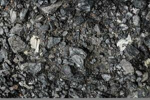 Natural black coals for the background, Heap of black coal closeup view. photo