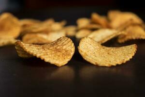 Potato chips on a wooden table, Potato chips on a wooden background, photo