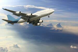 Airplane is flying above the clouds on beautiful sky background,Holidays and business concept photo