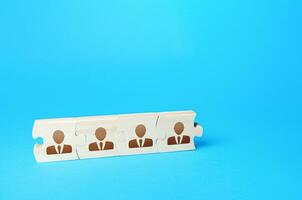 Connected puzzles people. Concept of recruiting new employees and expanding the staff of business company. Team building and bonding. Recruiting specialists. Partnership and cooperation. Collaboration photo
