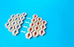 People are divided into two groups. Two camps of thought. Community split. Integrity violation. Opinion differences. Merging into a organization. Association breakup. Reconciliation and consensus photo