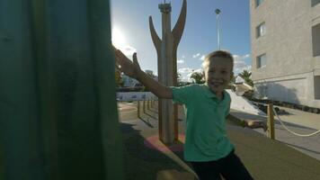 Boy running in playground maze video