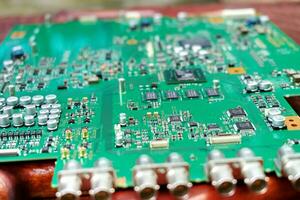 Green electronic circuit board texture background photo