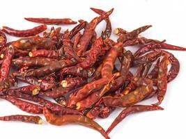 fresh and dried red hot chili peppers on a white background photo