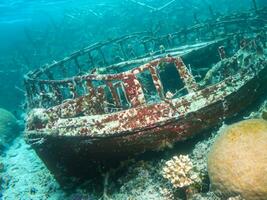 red shipwreck at the bottom of the sea. photo