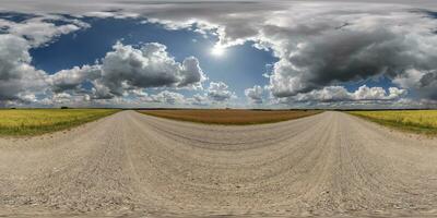 360 hdri panorama on white sand gravel road with clouds on blue sky in equirectangular spherical  seamless projection, skydome replacement in drone panoramas, game development sky dome or VR content photo