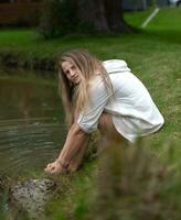 Young natural beautiful female on green nature background photo