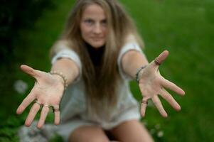 Young natural beautiful female on green nature background photo