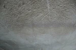 Cement and brick wall texture background, sun rays on the cement wall surface, smooth cement wall backdrop photo