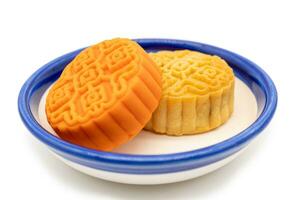 Moon Cakes on the plate isolated on white background. Concept for Mid-Autumn Festival. photo