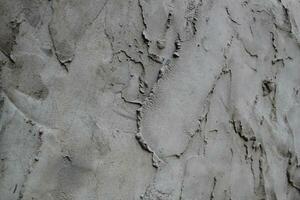 Uneven cement and sand wall texture background, grungy cement wall surface, rustic sand wall photo