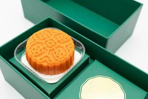 moon cake in green box. Moon cakes gift box for the Chinese Mid-autumn festival isolated on white background. photo